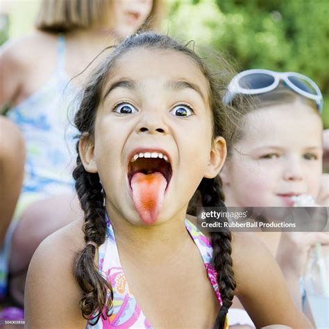 Little Girl Sticking Out Her Tongue High-Res Stock Photo - Getty Images