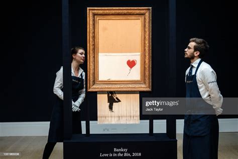 Sotheby's employees view 'Love is in the Bin' by British artist... News ...