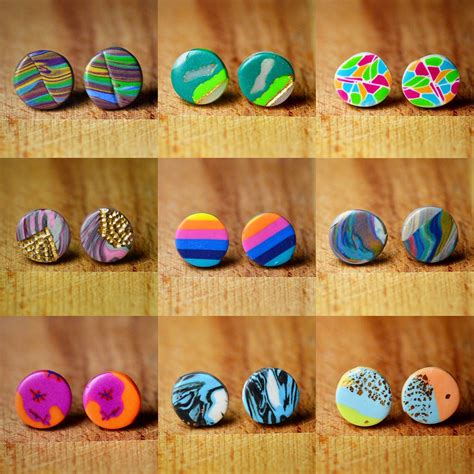 six different types of buttons on a wooden surface, all in different patterns and sizes