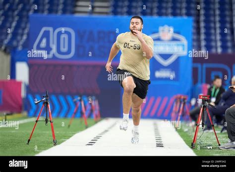 Kansas offensive lineman Dominick Puni runs a drill at the NFL football ...