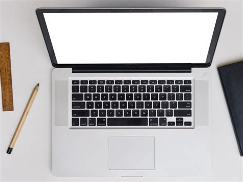 Free Laptop Mockup – Svelte Laptop On White Table
