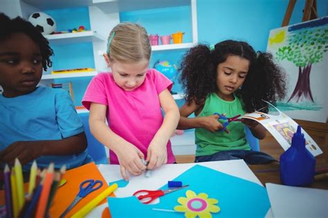 Premium Photo | Happy kids doing arts and crafts together