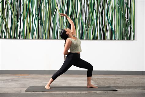 Barefoot young girl practicing yoga indoors – Authentic Stock