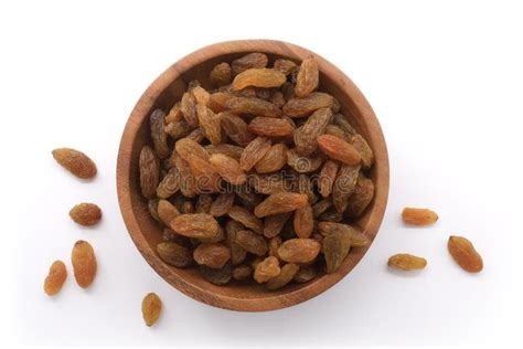 Raisins in Wooden Bowl Isolated on White Background. Dried Seedless Grapes. Healthy Nutrition ...