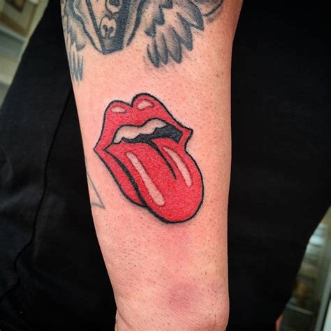 Hand poked The Rolling Stones logo tattoo on the