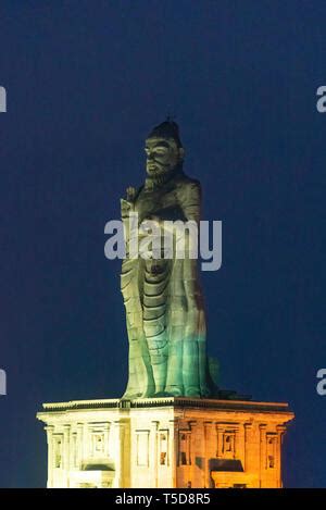 Vertical view of the Thiruvalluvar Statue lit up at night in Kanyakumari, India Stock Photo - Alamy