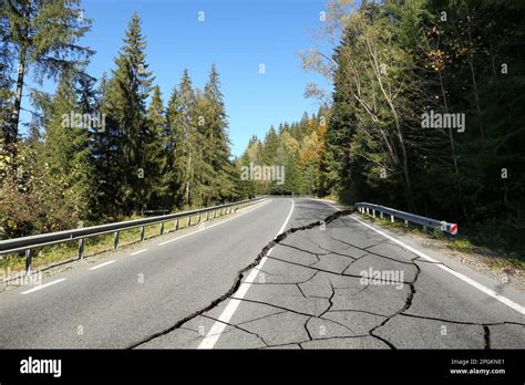 Large cracks on asphalt road after earthquake Stock Photo - Alamy