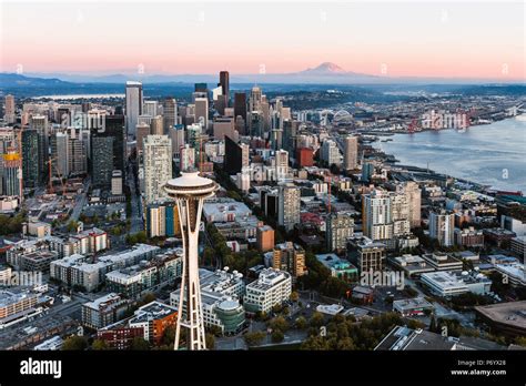 Aerial view of The Space Needle and downtown skyline at sunset with Mt ...