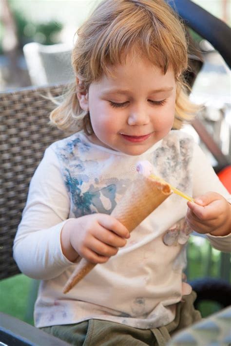 Happy Child Eating Ice Cream Cone with Spoon Stock Photo - Image of lovely, infant: 76534892