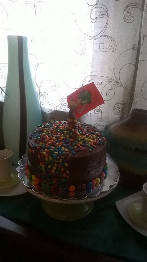 Chocolate cake with fudge icing, mini m&m's, m&m's with peanuts, and ...