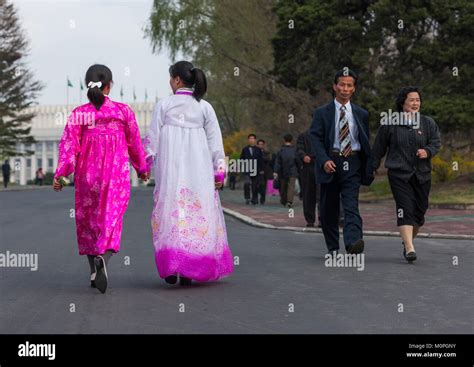 North Korean people with traditional and modern clothes in the street ...