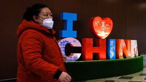 China ends Covid quarantine for travellers in January - BBC News