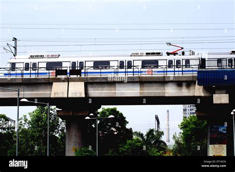 Delhi Metro, Metro system, Metro train on bridge at Panchkuan road ...