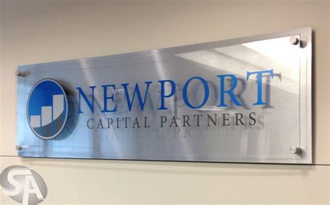 Brushed Aluminum Office Logo Sign with Stand Off System in Chicago, IL for Newport Capital Partners