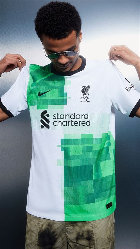 Liverpool unveil new away kit as Mohamed Salah and Co pose in white and ...