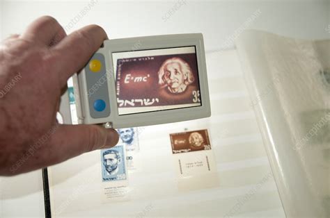 handheld electronic magnifier - Stock Image - C019/7241 - Science Photo Library