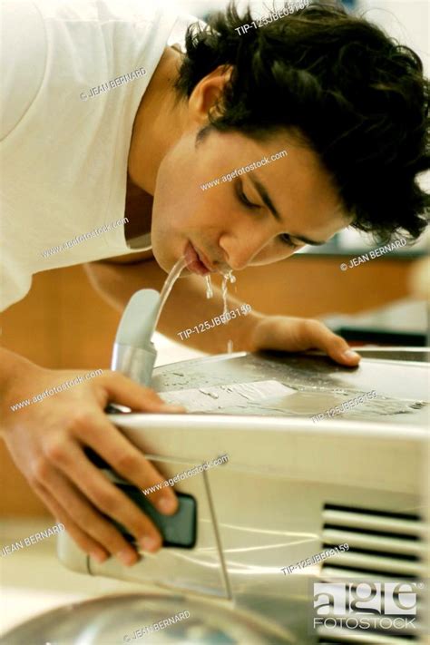 Man drinking water from fountain, Stock Photo, Picture And Rights ...