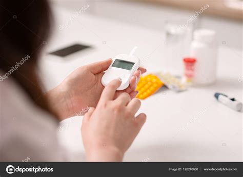 Ill woman controlling blood sugar level — Stock Photo © yacobchuk1 #192240630