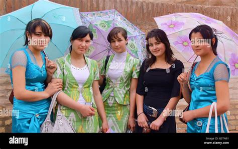 Portrait of Uzbek young women on a rainy day in Khiva, Uzbekistan Stock ...