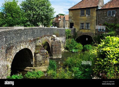 Old stone road bridge and houses over river Chew Pensford Avon Somerset Stock Photo - Alamy