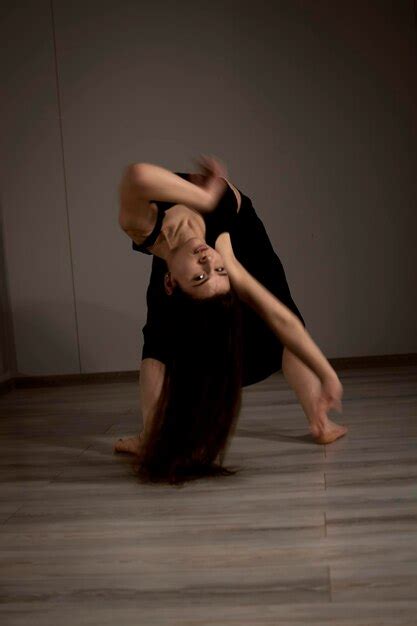 Premium Photo | Slender flexible dance performer during a dance practice in modern studio