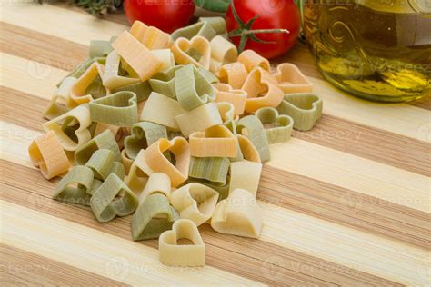 Raw heart-shaped pasta 8582780 Stock Photo at Vecteezy