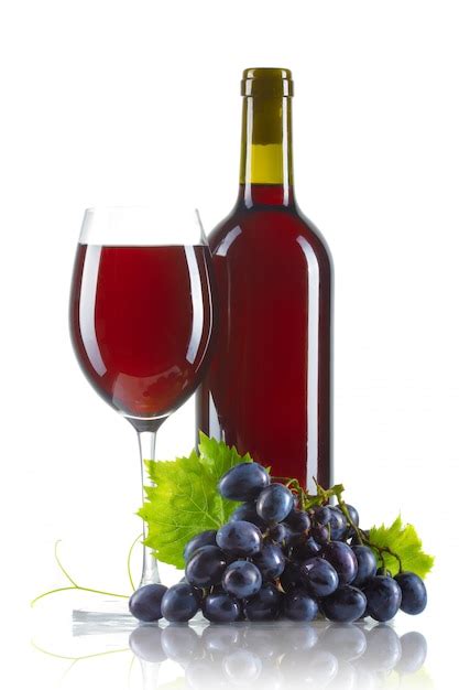 Premium Photo | Glass of red wine with bottle and ripe grapes isolated