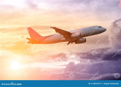 Silhouette of a Plane Flying in Beautiful Sunset Stock Image - Image of ...