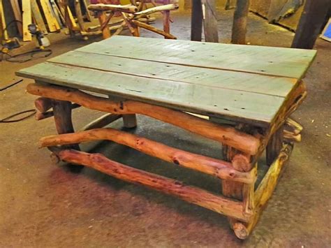 Rustic stick and log coffee table. | Log coffee table, Pallet coffee ...