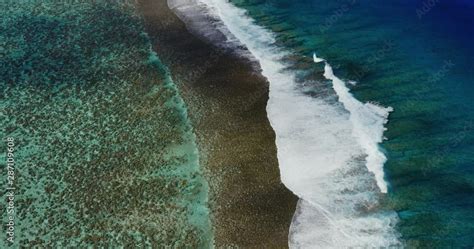 Aerial view of island reef with breaking waves Stock Video | Adobe Stock