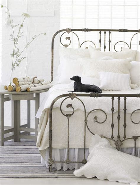 wrought iron bed + white bedoom