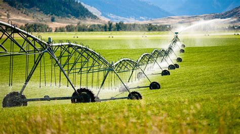 A large wheeled irrigation system in a field • Kishugu