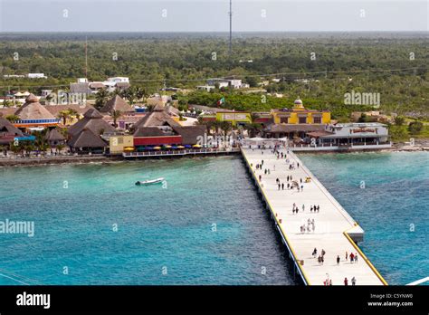 Cruise ship passengers walking on pier at port of Cozumel, Mexico in the Caribbean Sea Stock ...