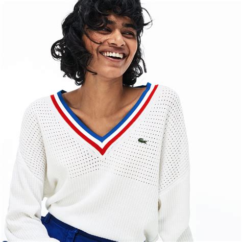 With a deep tricolor striped V-neck, this Made in France sweater is ...