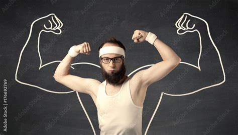 Young weak man with drawn muscles Stock Photo | Adobe Stock