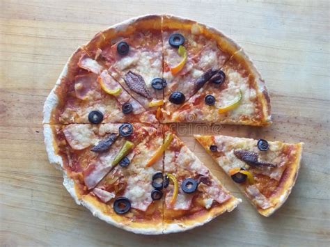 Pizza with Black Olives and Anchovies Stock Photo - Image of large ...