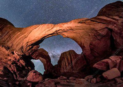 Night sky over Double Arch, Utah, USA - Stock Image - C038/3199 - Science Photo Library