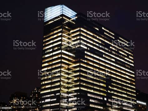 Modern Skyscraper Closeup At Night Stock Photo - Download Image Now ...