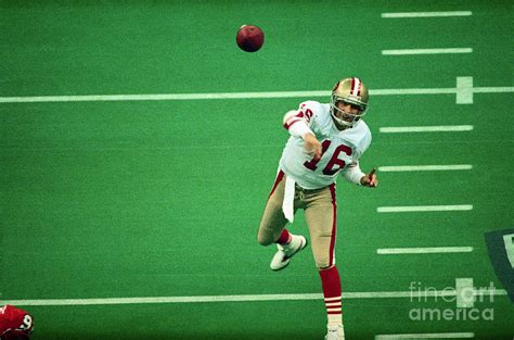 Joe Montana Throwing Football by Bettmann