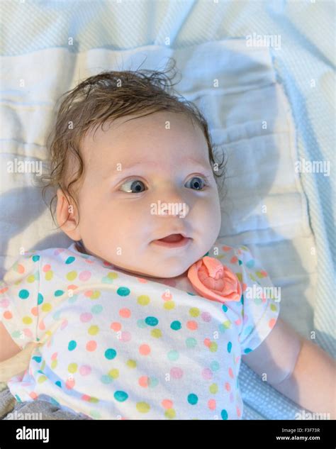 Baby girl curly hair blue eyes hi-res stock photography and images - Alamy