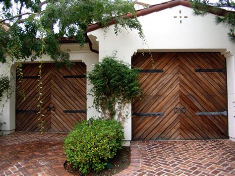 These custom made Spanish style garage doors feature a beautiful herringbone pattern and feature ...