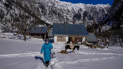 In Pics | Vaccine workers trudge through snow in Kashmir making their way to cut-off villages