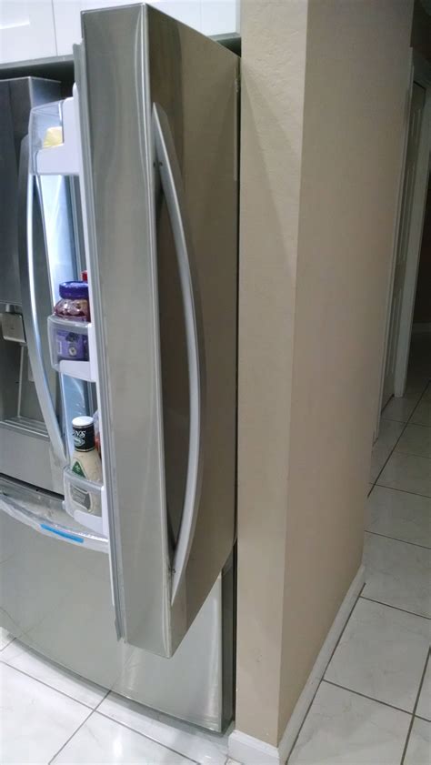 How can I prevent my refrigerator door from hitting the wall? - Home Improvement Stack Exchange
