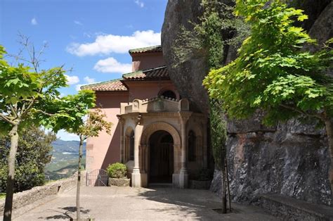 Premium Photo | Church under the mountain. entrance to the old church. church in the mountains.