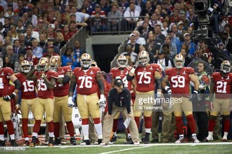 San Francisco 49ers coach Jim Harbaugh on sidelines with players... News Photo - Getty Images