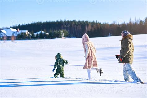 Nice happy family having fun on winter snow 15884011 Stock Photo at ...