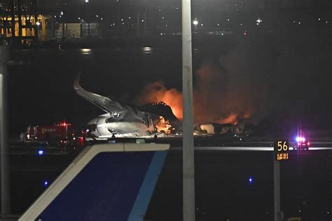 Japan Airlines jet bursts into flames after collision on Tokyo runway