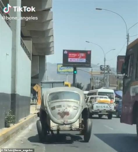 Hilarious video shows driver using his feet like Fred Flintstone to power his car in Peru ...