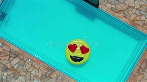 Smile Emoji Icon Floating at Swimming Pool at Countryside Stock Video ...