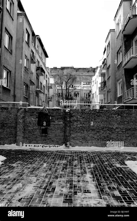 Front of one of two remaining pieces of the Warsaw Ghetto wall, Poland ...